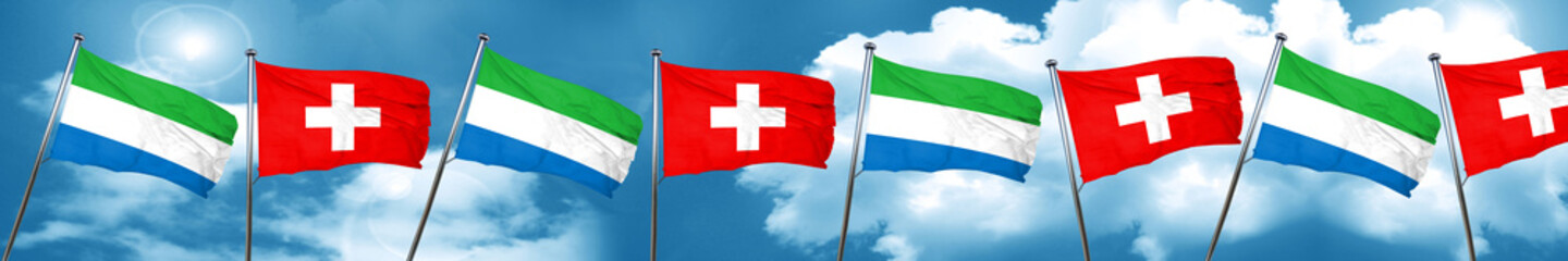 Sierra Leone flag with Switzerland flag, 3D rendering