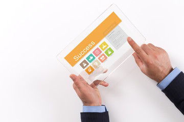 Hand Holding Transparent Tablet PC with Success screen