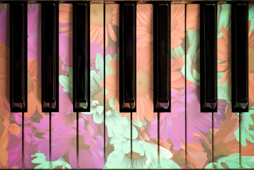 beautiful flowers on piano keys for natural sound concept background