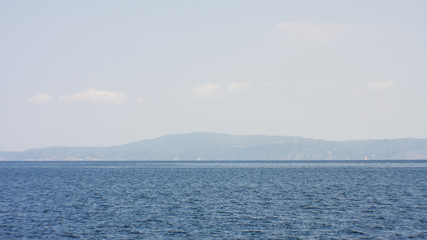 Obraz premium Landscape with water and Mount Athos in the background - Aegean sea, Greece