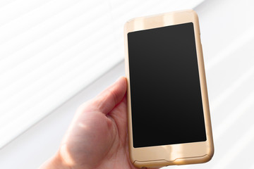 Close up of a woman using mobile smart phone outdoor