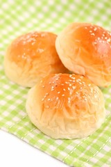 Fresh Dinner Rolls on Green Kitchen Cloth