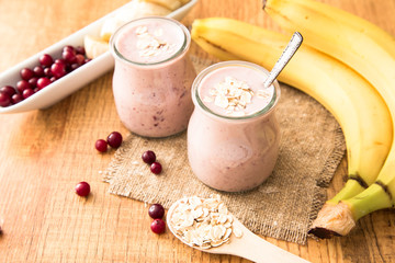 Smoothie of banana and cranberries with yogurt and oats 