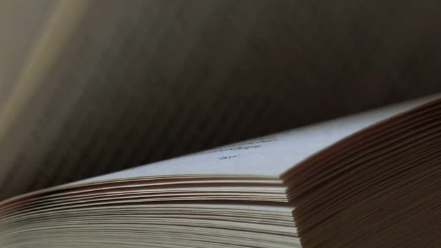 Book pages macro close up, low key footage