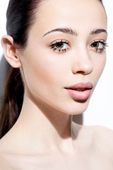 Fototapeta premium Closeup portrait of beautiful young woman with creative makeup