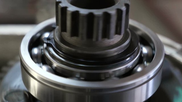 working of mechanism with ball bearing, close-up