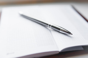 Notebook and Pen, Notebook and pen on white background.