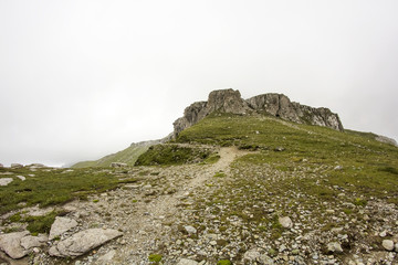 Landscape from Bucegi Mountains, part of Southern Carpathians in Romania in a foggy day