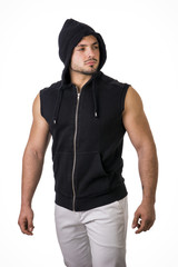 Confident muscular male bodybuilder during bulking phase or mass period, posing isolated on white.