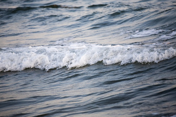 Wave and sand closeup
