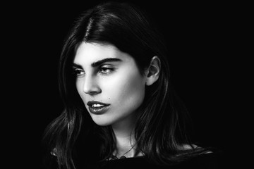 Fototapeta premium Woman portrait with gorgeous eyes looking aside black and white