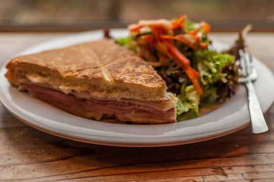 Muffuletta Sandwich And Salad In Cafe