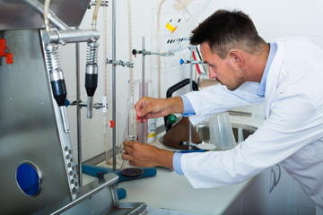 Man working on quality of products in lab