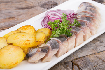Sliced herring with potatoes