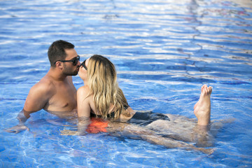 Honeymoon romantic lovers vacation on a tropical beach. Young happy lovers on romantic travel honeymoon having fun on vacation summer holidays romance.