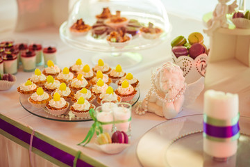 The sweety cakes stand on the buffet table