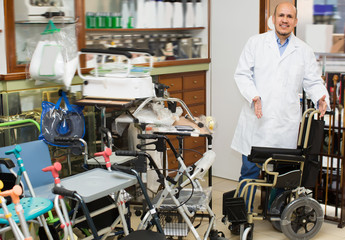 Physician posing near orthopaedic equipment