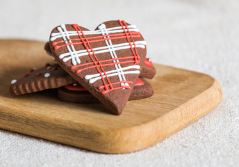Heart shaped chocolate Valentine's Day cookies with red and white glaze.