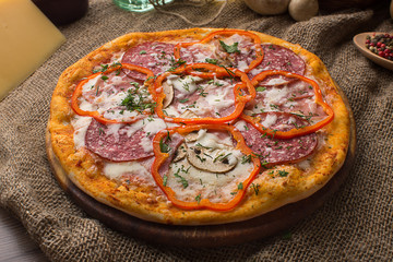 Delicious italian pizza served on sackcloth