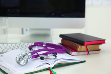 Stethoscope and computer on a desk in the office