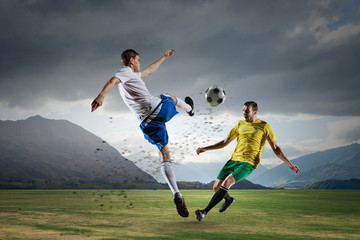 Obraz na płótnie Canvas Soccer player outdoors . Mixed media