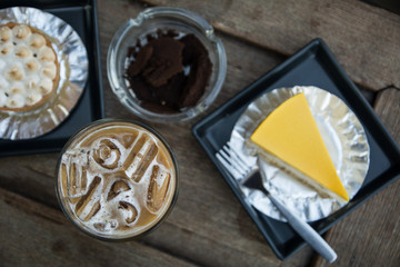 Coffee & cake on wooden table background in breakfast meal