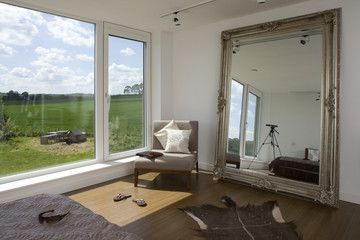 Bedroom with view to countryside in carbon neutral home