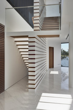 Entrance hallway and staircase in modern residential house 