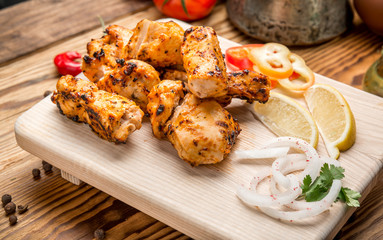 Assorted delicious grilled meat with vegetable on white plate  picnic table for family bbq party