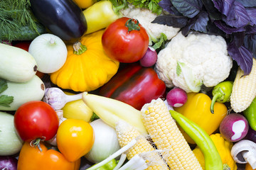 Background of fresh vegetables and greens closeup 