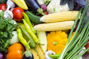 Background of fresh vegetables and greens closeup 