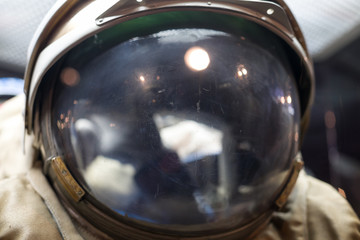 Closeup of astronaut helmet with reflections. Space and exploring.