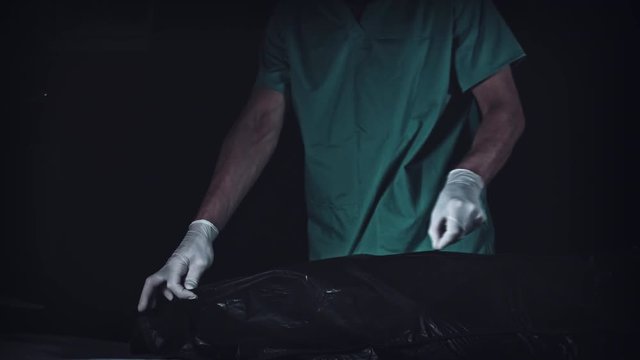 4K Crime Morgue Mortician Opens Black Bag with Dead Body