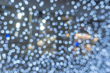 Bokeh lights white in night Christmas.