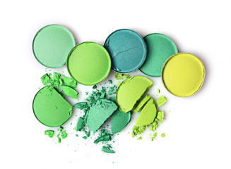 Fototapeta na wymiar Round green crashed eyeshadows for makeup as sample of cosmetics product