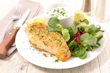 chicken breast with crumbs and sauce