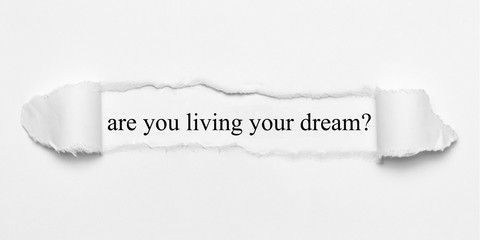 are you living your dream? on white torn paper