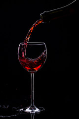 Wine glasses with wine bottle on a black background, minimalism,
