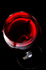 Wine glasses with wine bottle on a black background, minimalism,