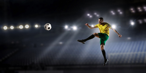 Soccer player at sport arena . Mixed media