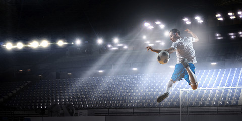 Obraz premium Soccer palyer kick ball . Mixed media