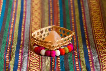 colorful handmade fabric and colorful wool .
