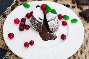 Chocolate fondant with cranberry sauce.