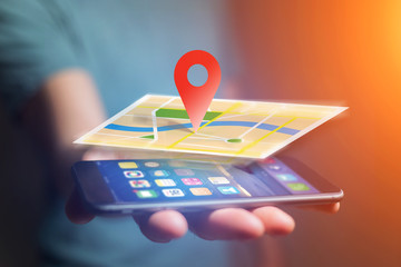 Vuiew of a Concept of geographical localization on a map with a smartphone