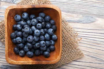 ripe sweet blueberries on wooden table