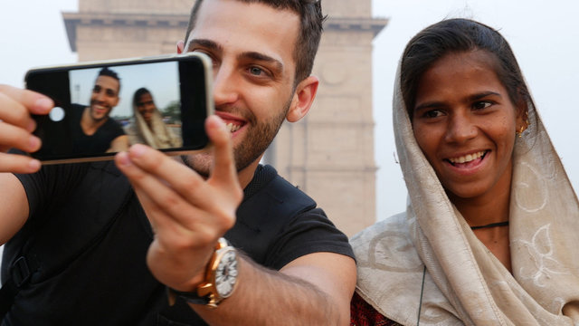 Tourist taking a selfie with a Local Woman in India Gate, New Delhi
