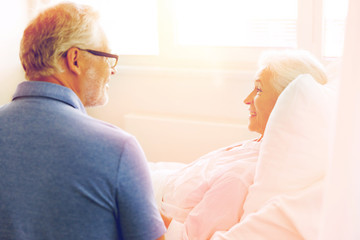 senior couple meeting at hospital ward