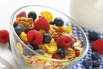 bowl of breakfast cereals and fresh berry fruit