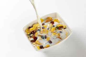 milk pouring into breakfast cereals