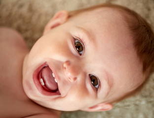 close up of happy little baby boy or girl face